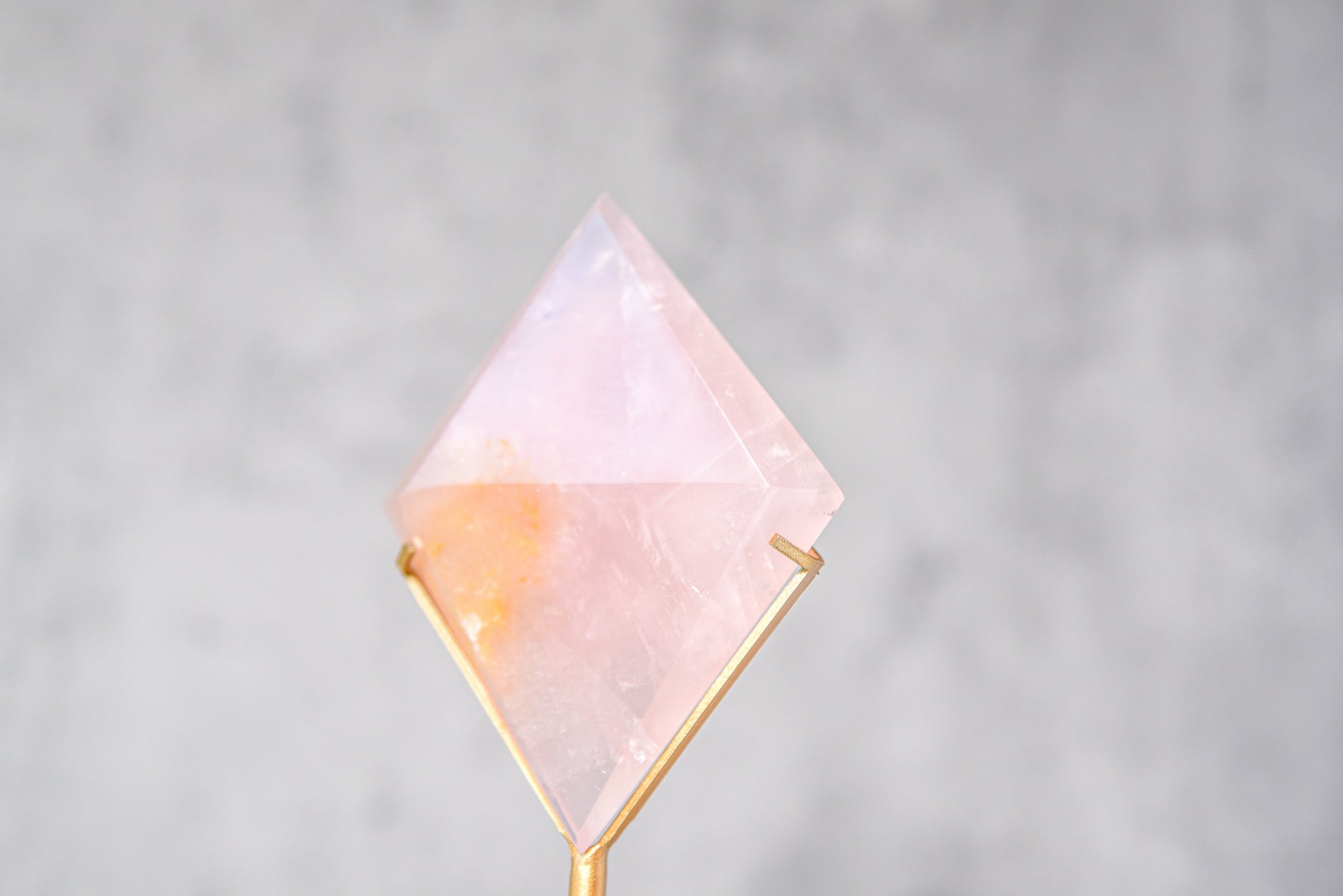 Rose Quartz Diamond on a Gold Stand