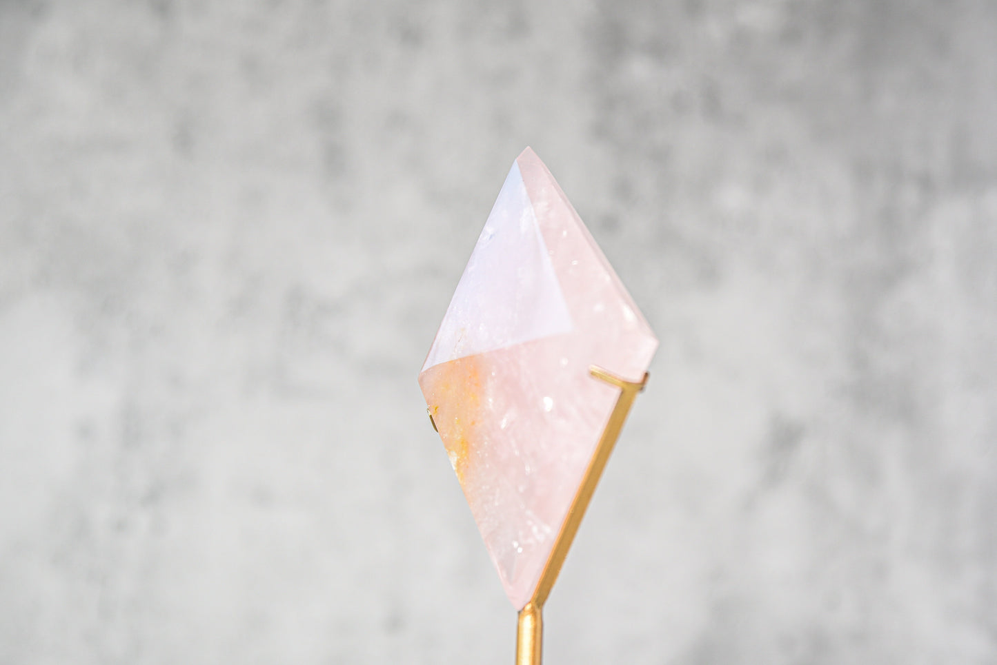 Rose Quartz Diamond on a Gold Stand