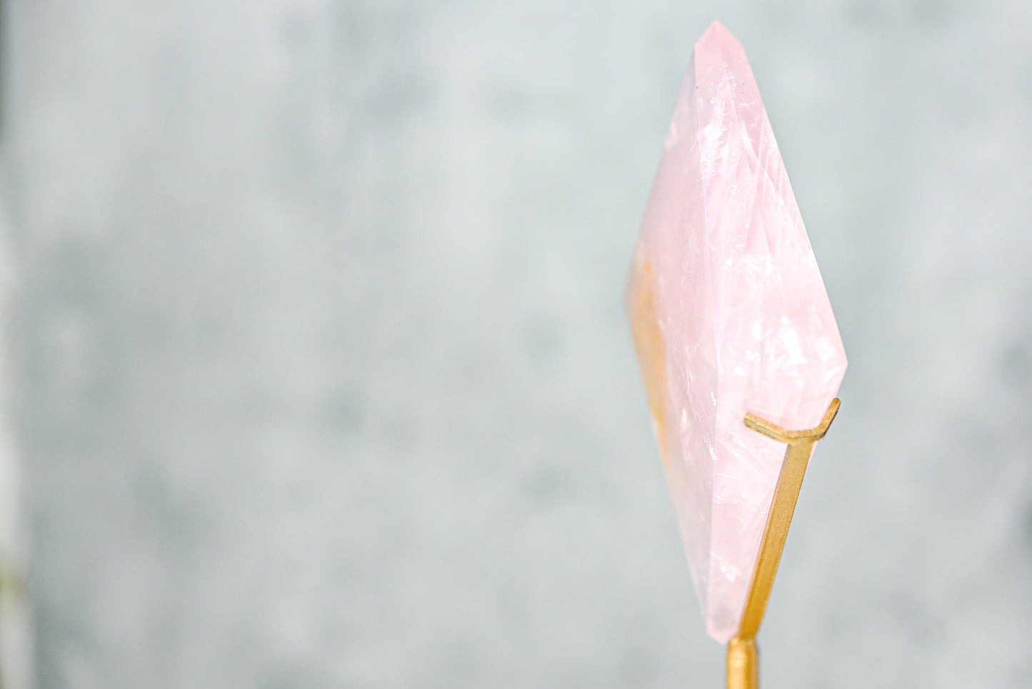 Rose Quartz Diamond on a Gold Stand