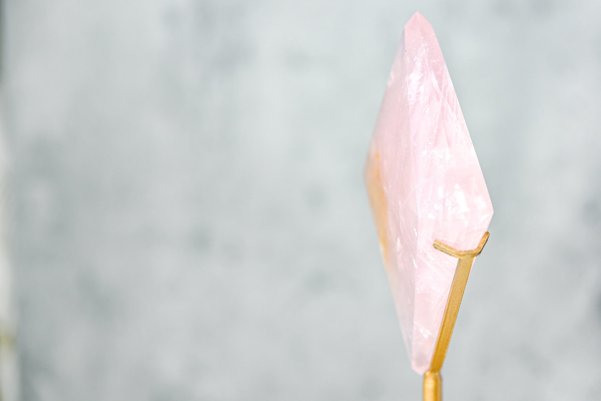 Rose Quartz Diamond on a Gold Stand