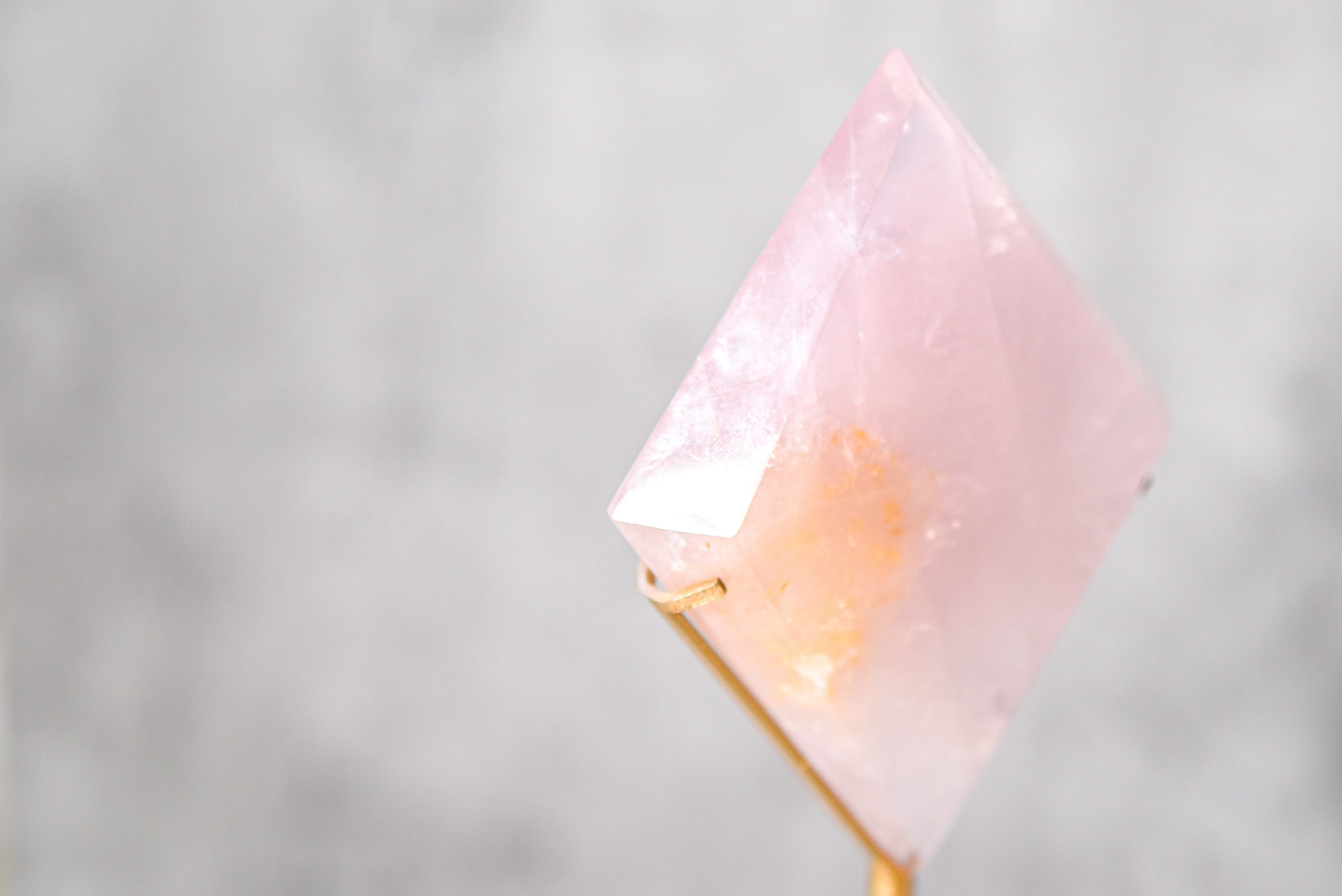 Rose Quartz Diamond on a Gold Stand